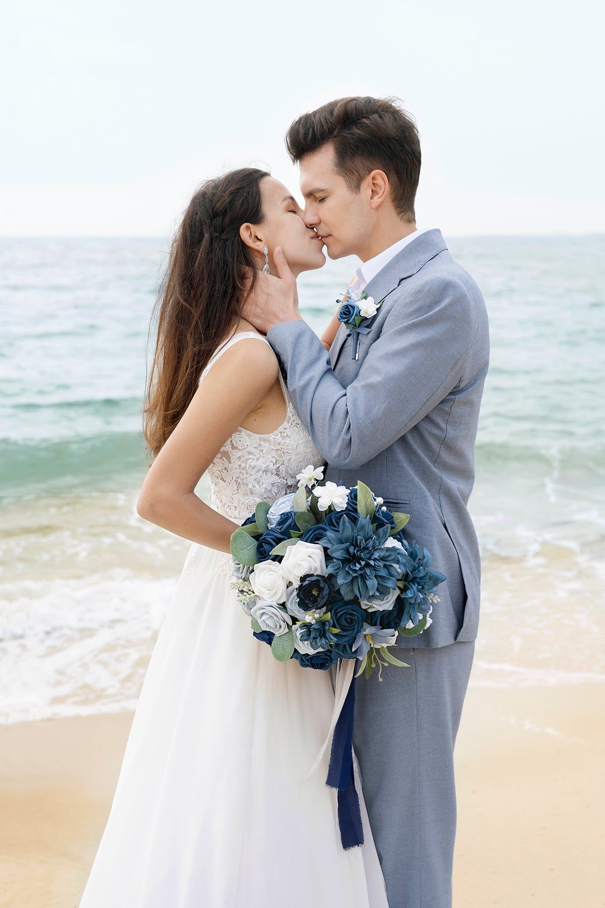 Light Grey Groom Suit with Blue Corsage for Shades of Blue Beach Wedding Color Combos 2024