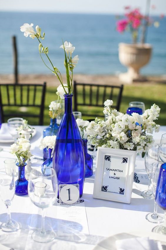royal blue vases and bottles and white flower wedding table decorations for royal blue wedding colors 2024 royal blue and white