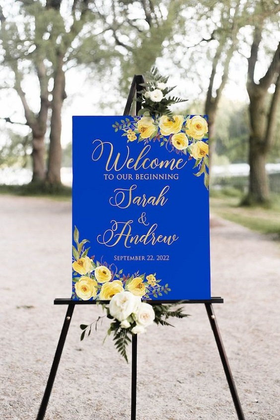 royal blue wedding welcome sign with yellow floral printing for royal blue wedding colors 2024 royal blue and yellow