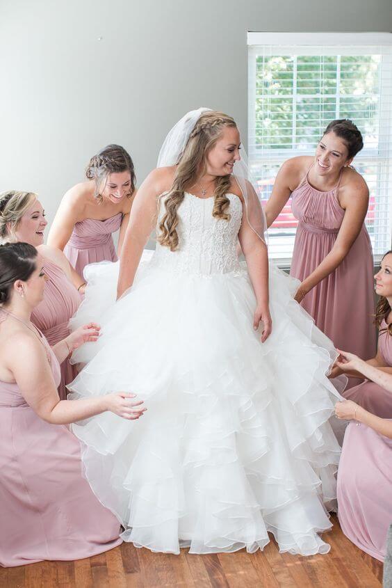 White bride and bridesmaids for Dusty rose pink wedding