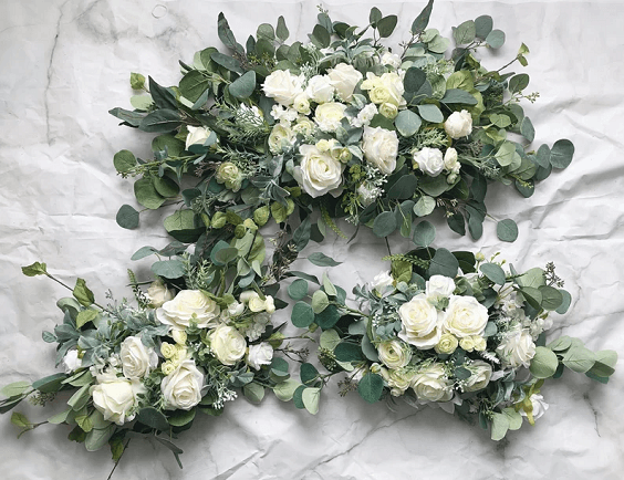green and white flower wedding table garland for march wedding colors combos for 2024 sage green and whisper white