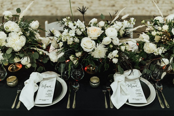white flower and greenery wedding table centerpieces for january wedding colors for 2024 black white and greenery