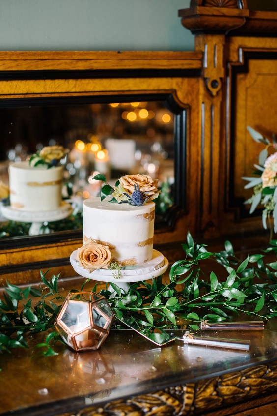 white wedding cake dotted with yellow flowers for january wedding colors for 2024 red raspberry and yellow