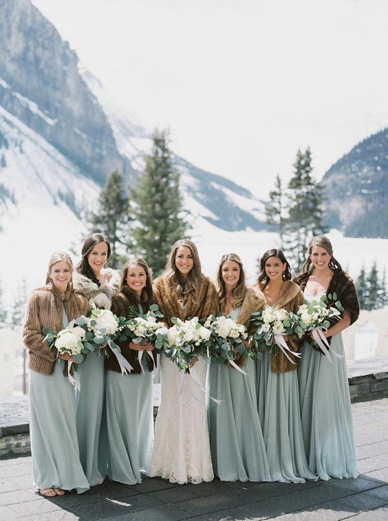 sage green bridesmaid dresses with brown fur white bridal gown for january wedding colors for 2024 sage green and brown