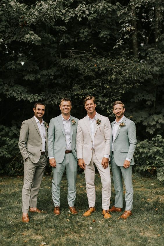 sage green groomsmen suits and beige bridegroom suit for january wedding colors for 2024 sage green and brown