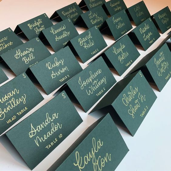 Forest green place cards with gold lettering for Forest Green Wedding Color Combos 2024