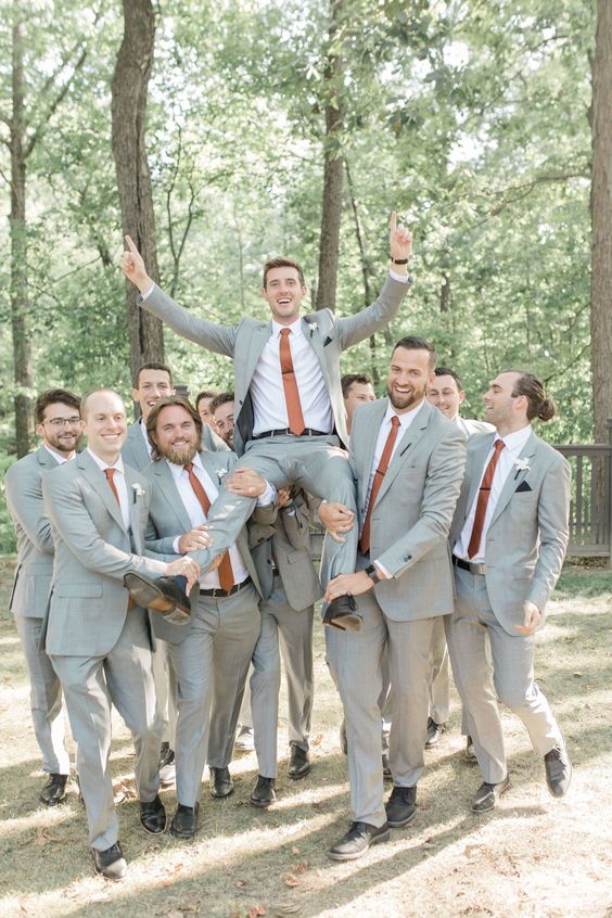 grey bridegroom and groomsmen suits and burnt orange ties for burnt orange wedding colors for 2024 burnt orange and grey