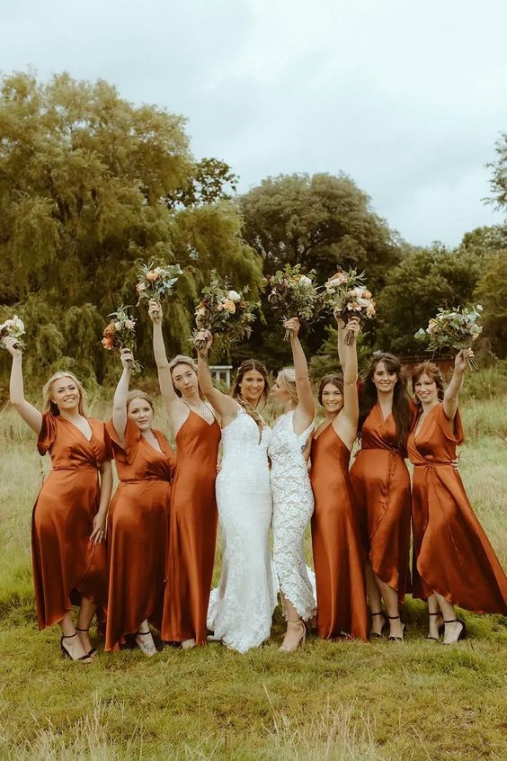 burnt orange bridesmaid dresses and white bridal gown for burnt orange wedding colors for 2024 burnt orange and sage green