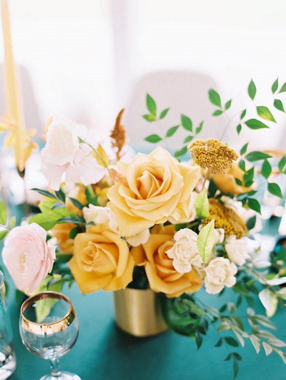 emerald wedding tablecloth yellow flower centerpieces in gold bottles for emerald green and gold wedding colors emerald gold and yellow