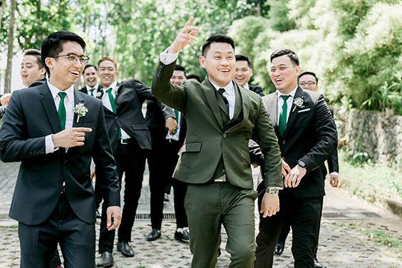 black groomsmen suits and emerald ties for emerald green and gold wedding colors emerald gold and white