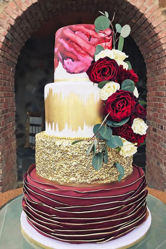 gold and burgundy wedding cake dotted with greenery for emerald green and gold wedding colors emerald gold and burgundy