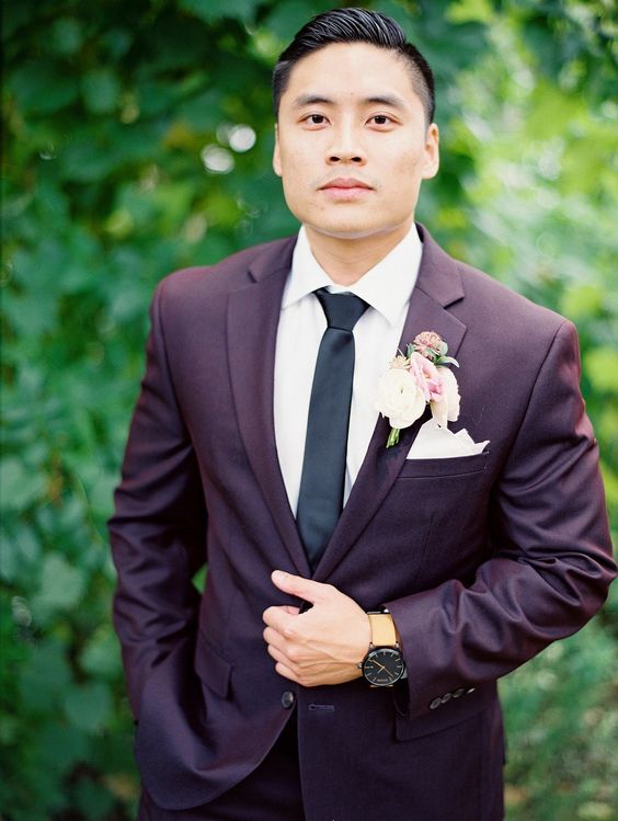 dark purple groom attire with white and pink flowers for purple wedding colors combos for 2024 dark purple and white