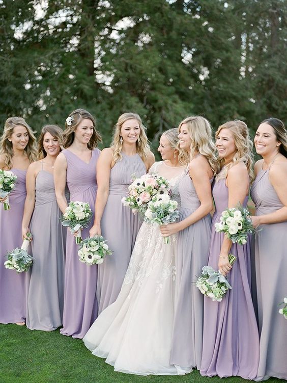 white wedding gown and light purple bridesmaid dresses for purple wedding colors combos for 2024 light purple and pink