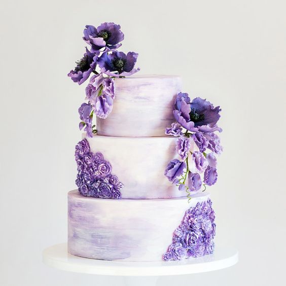 white wedding cake with dark purple flowers for purple wedding colors combos for 2024 dark purple and pastel lilac