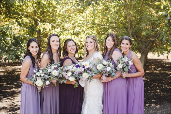 white wedding gown and pastel lilac dark purple bridesmaid dresses for purple wedding colors combos for 2024 dark purple and pastel lilac