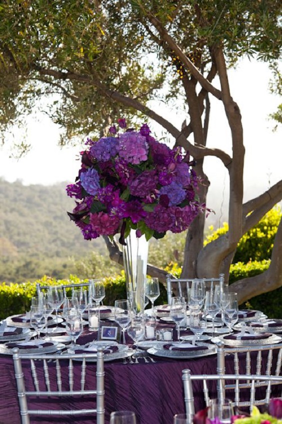 royal purple wedding table with purple shades flowers centerpiece for purple wedding colors combos for 2024 royal purple and chalk violet