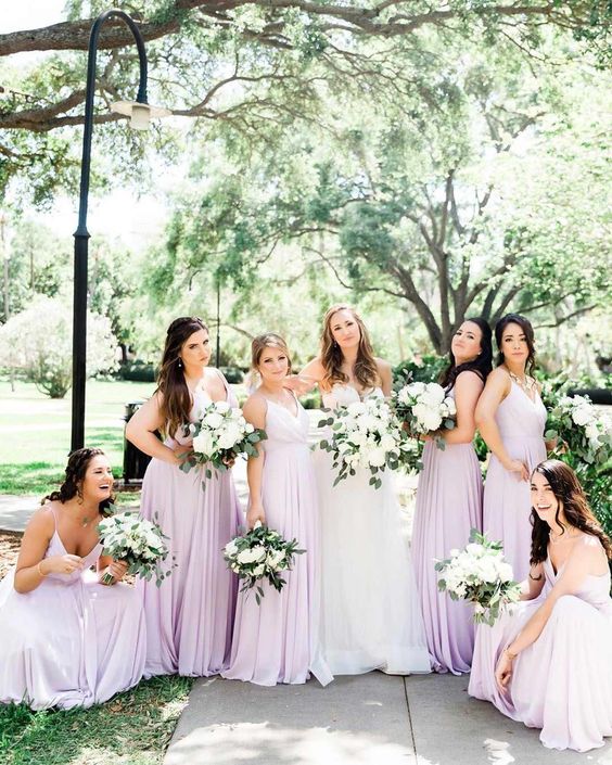white bridal gown and pastel lilac bridesmaid dresses for july wedding colors combos for 2024 pastel lilac and white