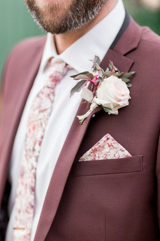 burgundy groom attire with light pink flower for july wedding colors combos for 2024 burgundy and ivory