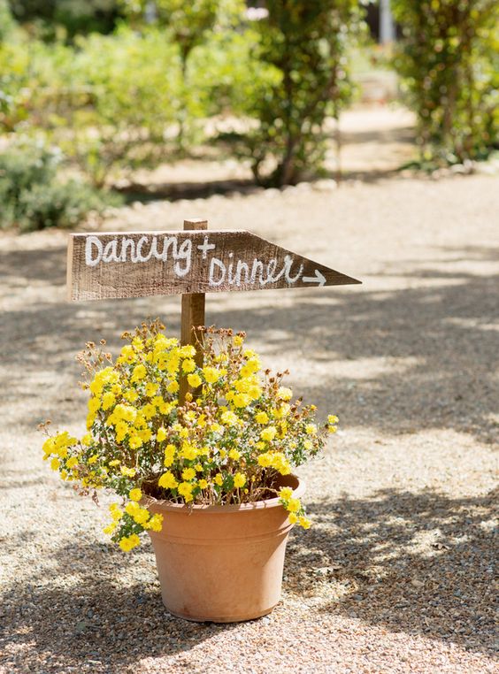 yellow flower with wooden direction sign for country wedding colors for 2025 yellow and white