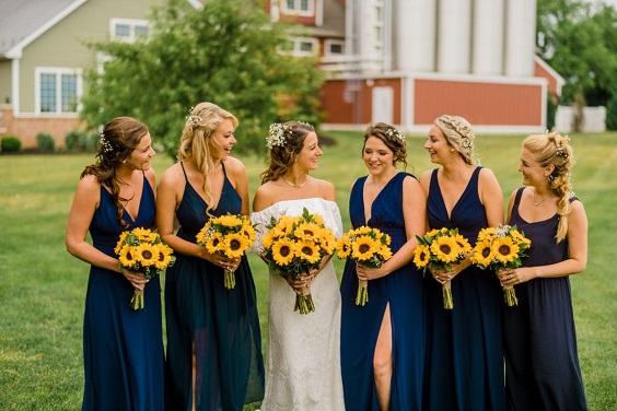 navy blue bridesmaid dresses white bridal gown sunflower bouquets for rustic themed wedding colors for 2025 navy blue and sunflower