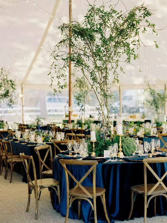 navy blue wedding tablecloth and dark green greenery centerpieces for navy blue wedding colors for 2025 navy blue dark green and white