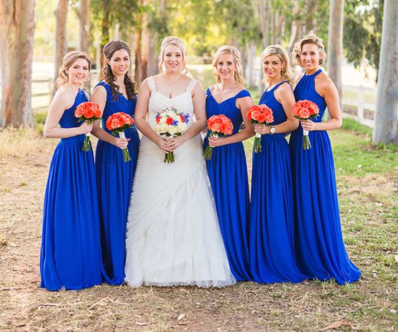 royal blue bridesmaid dresses and a white bridal gown for blue wedding colors combos for 2025 royal blue and orange