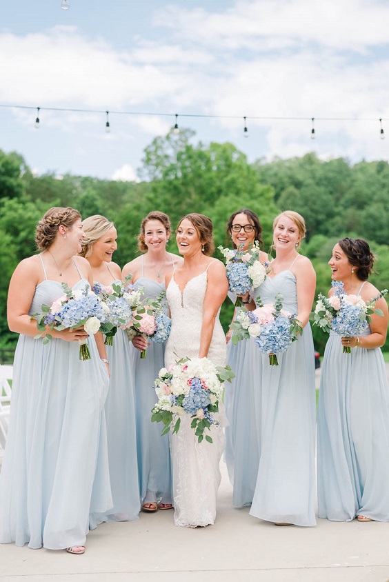 dusty blue bridesmaid dresses and white bridal gown for blue wedding colors combos for 2025 dusty blue cream and peach
