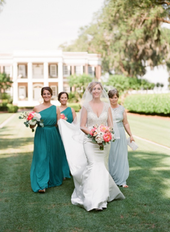 teal and light grey bridesmaid dresses and a white bridal gown for blue wedding colors combos for 2025 teal pink and red