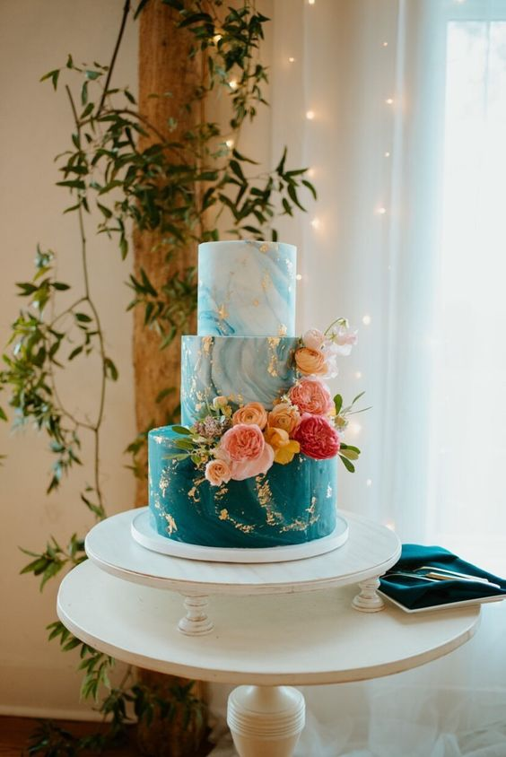 teal wedding cake with red pink flowers for blue wedding colors combos for 2025 teal pink and red