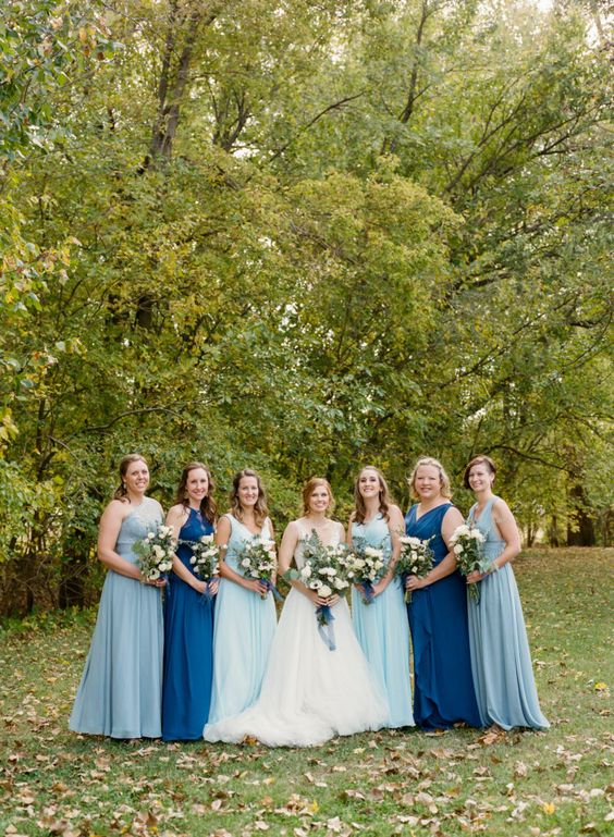 illusion blue and moroccan blue bridesmaid dresses and a white bridal gown for blue wedding colors combos for 2025 teal illusion blue and moroccan blue