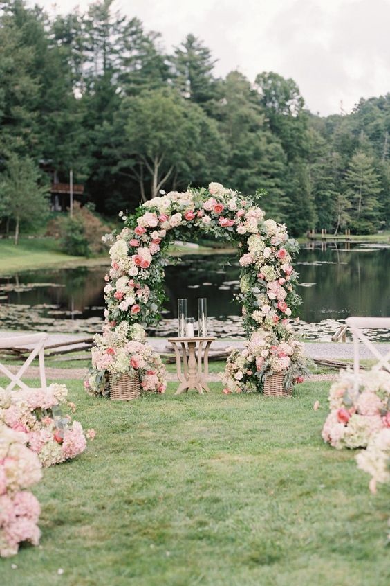 wedding arch with pink and light pink flowers for june wedding colors combos for 2025 light pink and pink