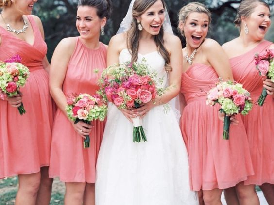 coral bridesmaid dresses and white bridal gown for june wedding colors combos for 2025 coral and almost apricot