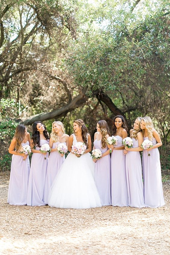 pastel lilac bridesmaid dresses and white bridal gown for june wedding colors combos for 2025 pastel lilac and light pink