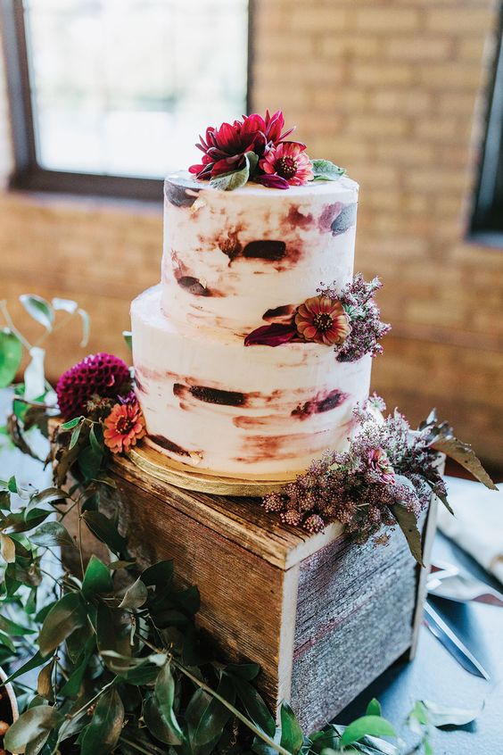 nude wedding cake dotted with burgundy and peach flower for burgundy wedding colors for 2025 burgundy and peach