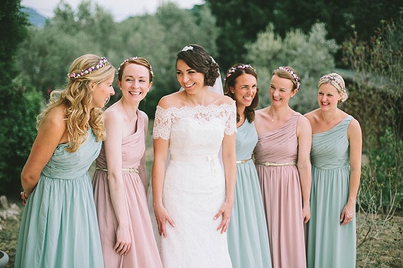 beryl green and silver pink bridesmaid dresses and a white wedding gown for may wedding colors combos for 2025 silver pink and beryl green