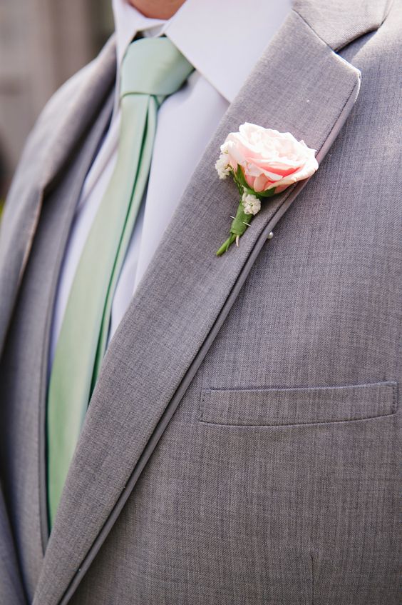 grooms attire with beryl green tie and a silver pink flower for may wedding colors combos for 2025 silver pink and beryl green