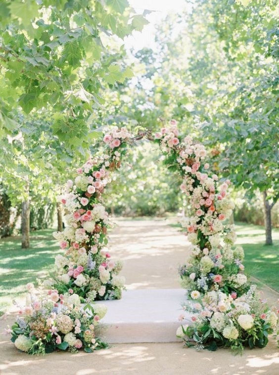 wedding arch with silver pink and cream flowers for may wedding colors combos for 2025 silver pink and beryl green