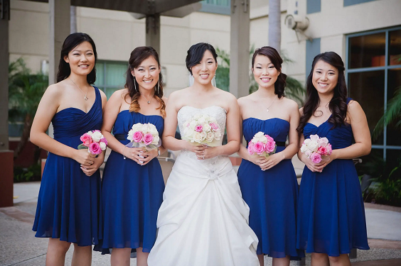 royal blue bridesmaid dresses and a white bridal gown for may wedding colors combos for 2025 royal blue and pink