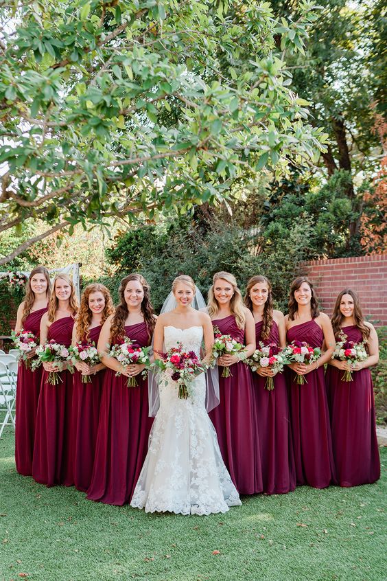 burgundy bridesmaid dresses and a white wedding gown for may wedding colors combos for 2025 burgundy and pink