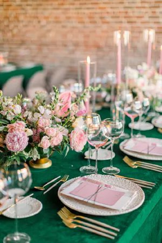 dark green table cloth and pink flowers and candles for may wedding colors combos for 2025 dark green and pink