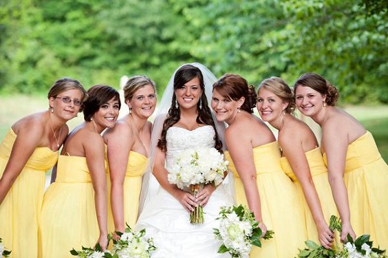 yellow bridesmaid dresses and a white bridal gown for may wedding colors combos for 2025 yellow and white