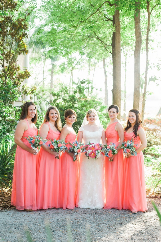 coral bridesmaid dresses and a white bridal gown for april wedding colors combos for 2025 coral peach and orange