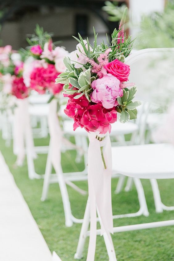 hot pink and dusty rose flowers at wedding chairs for april wedding colors combos for 2025 hot pink and dusty rose