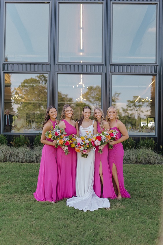 hot pink bridesmaid dresses and a white wedding gown for april wedding colors combos for 2025 hot pink and dusty rose