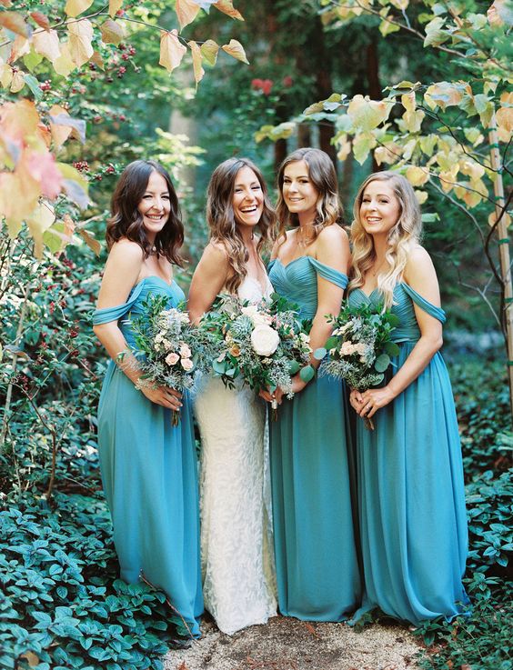 teal bridesmaid dresses and a white wedding gown for april wedding colors combos for 2025 teal red and pink