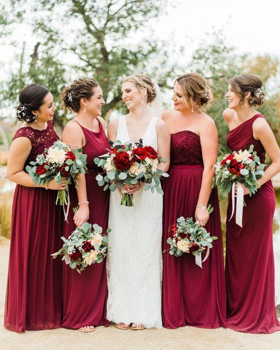 dark red bridesmaid dresses and a white wedding gown for april wedding colors combos for 2025 dark red cream and pink