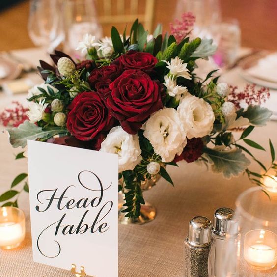 wedding centerpiece with dark red and cream flowers for april wedding colors combos for 2025 dark red cream and pink