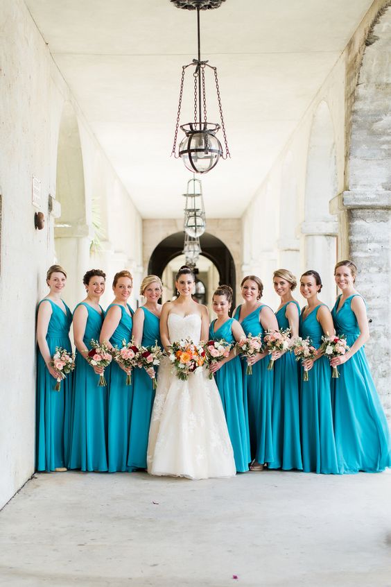 teal bridesmaid dresses white bridal gown orange and red flower bouquets for teal wedding colors for 2025 teal and white