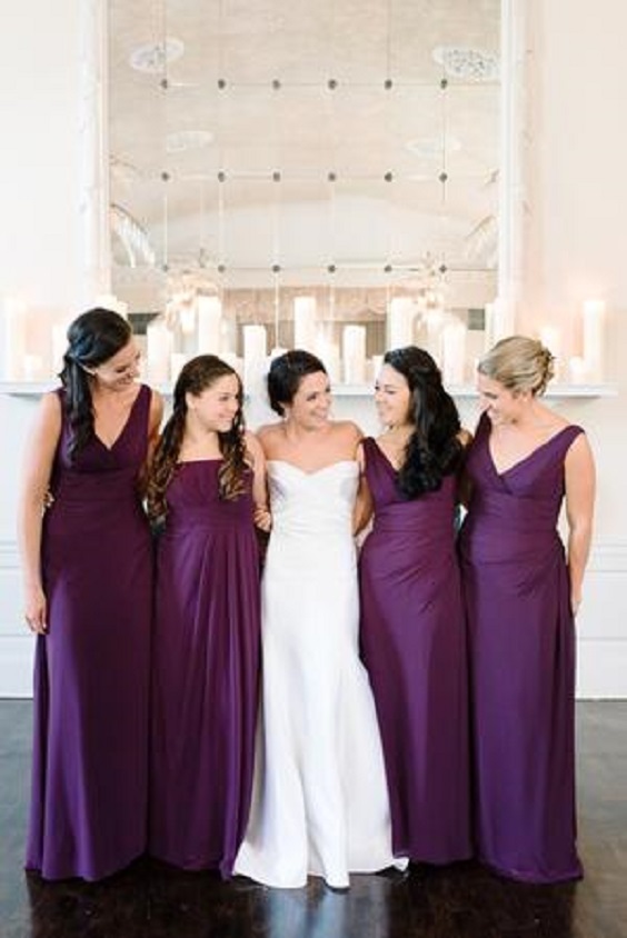 dark purple bridesmaid dresses and a white wedding gown for purple wedding colors combos for 2025 dark purple and light purple