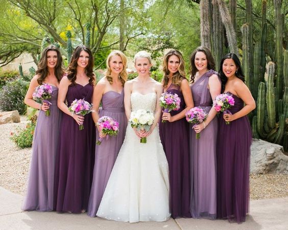 plum and lavender bridesmaid dresses and a white wedding gown for purple wedding colors combos for 2025 shades of purple
